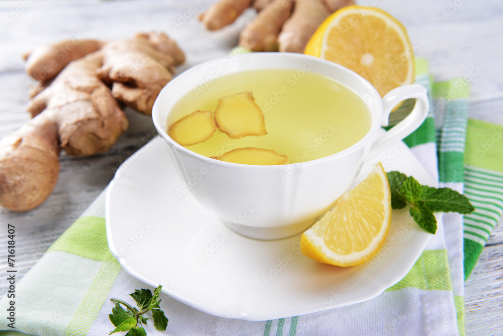 Ginger tea with lemon on table close-up Ginger tea with lemon on table close-up