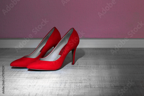 Red women shoes on floor in room