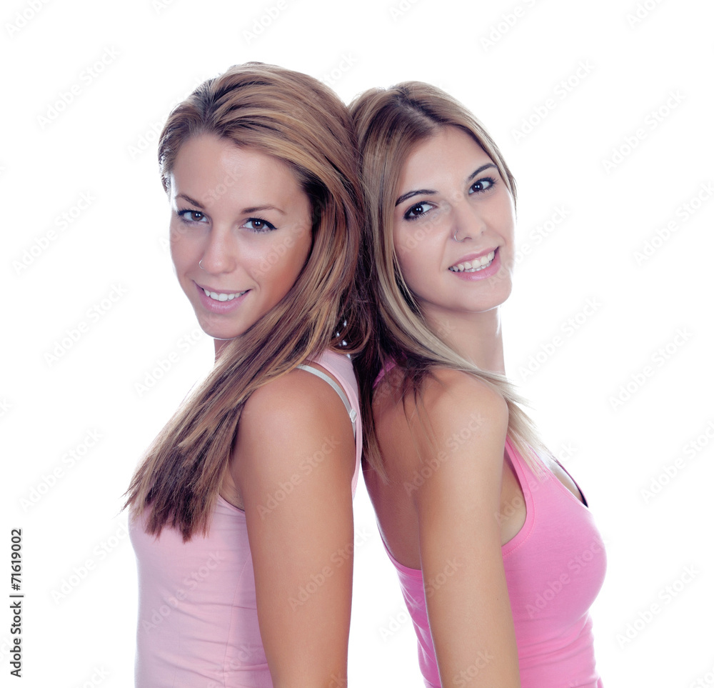 Two beautiful girl friends in pink Two beautiful girl friends in pink