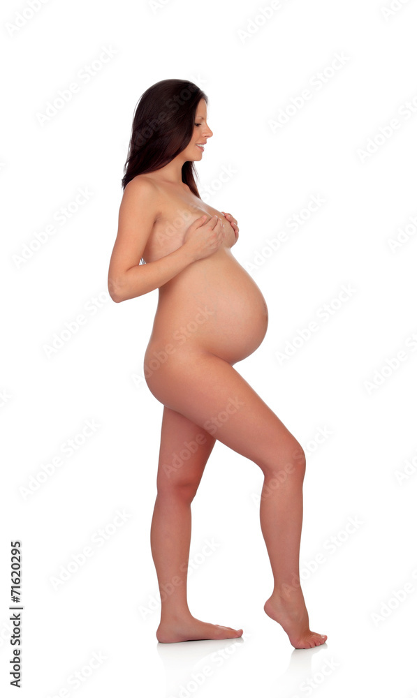 Fototapeta premium Delicate pose of a pregnant woman with naked torso
