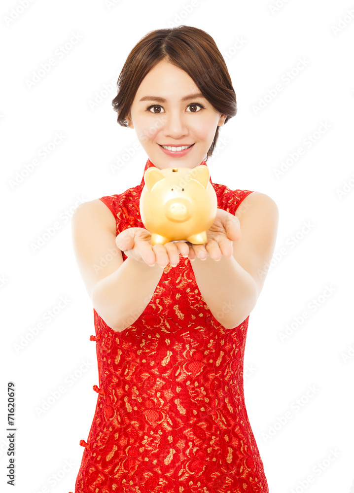 woman holding a golden piggy bank . happy chinese new year