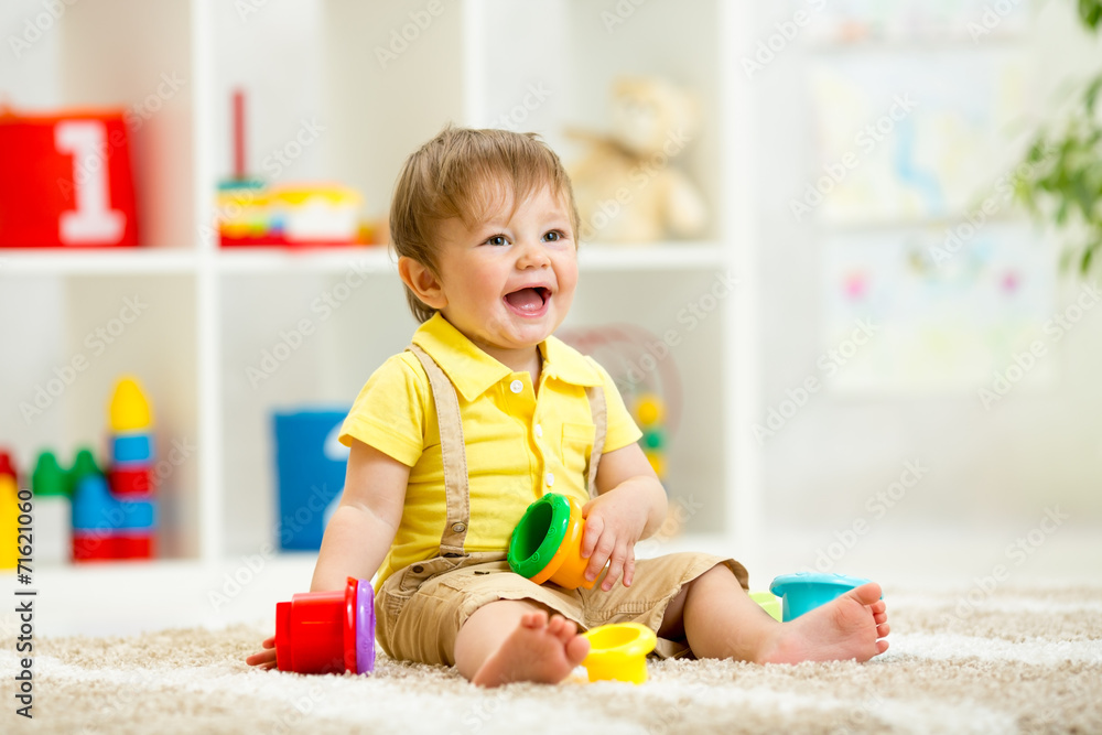 Funny little child playing with toys Funny little child playing with toys