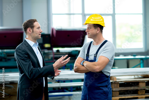 young boss and worker in conversation