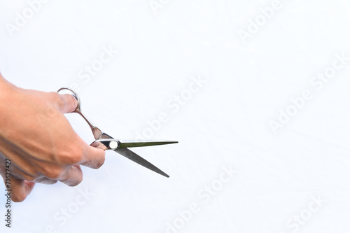 Hair s scissors in hands isolate on white background