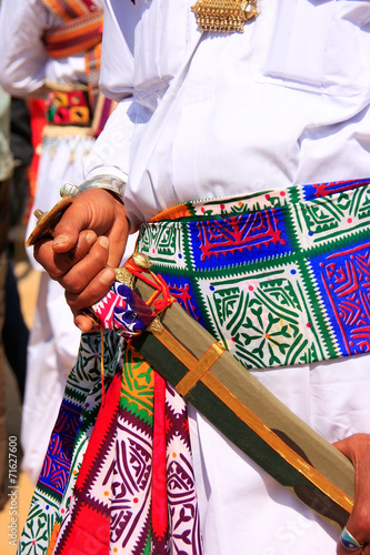 Close up of hands holding sword during Mr Desert competition, Ja