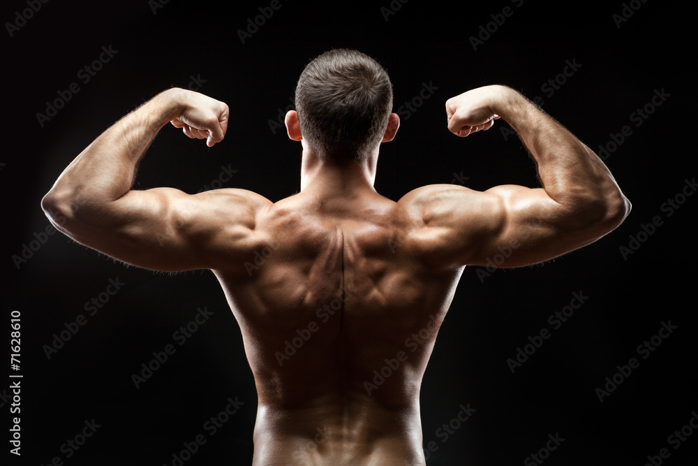 Man back shows big muscles.