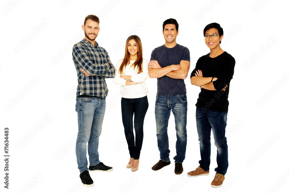 young friends with arms folded standing over white background young friends with arms folded standing over white background