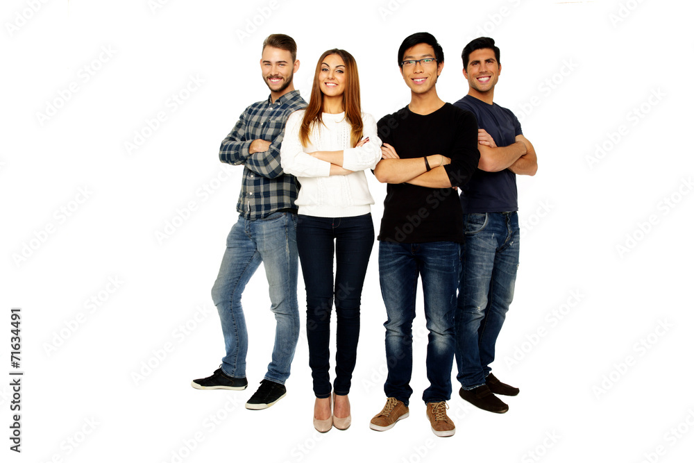 young friends with arms folded standing over white background young friends with arms folded standing over white background