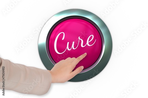 Hand pressing pink button for breast cancer awareness