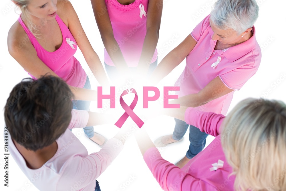 Group wearing pink and ribbons for breast cancer Group wearing pink and ribbons for breast cancer