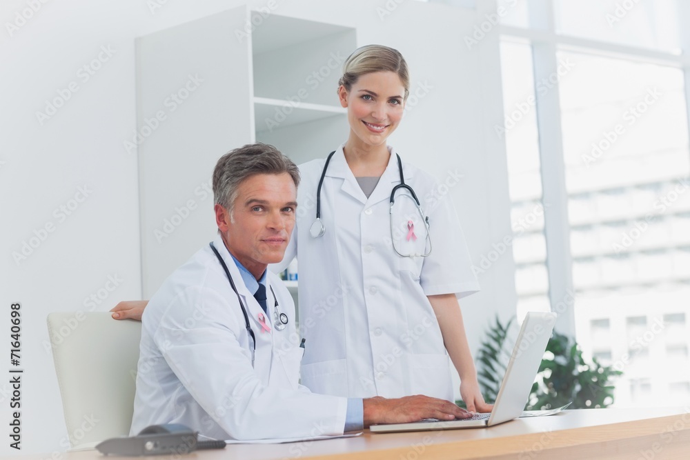 Composite image of medical team at the office Composite image of medical team at the office