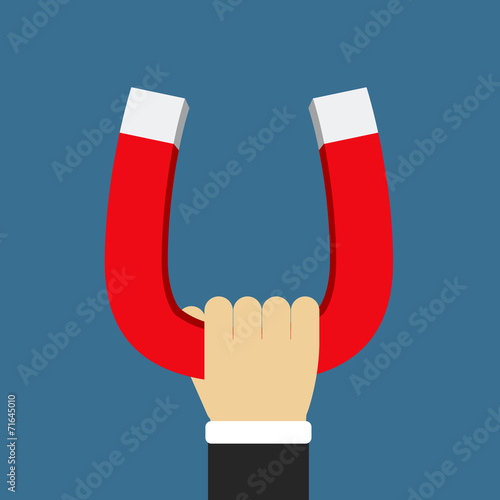 Hand Holding Magnet