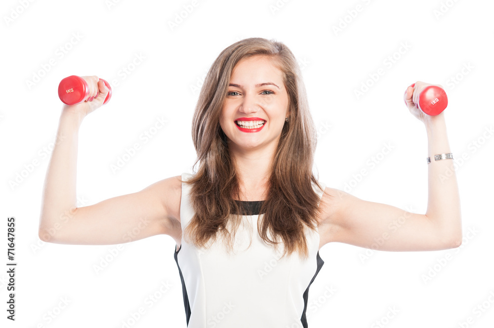 Smiling woman lifting small weights. Smiling woman lifting small weights.