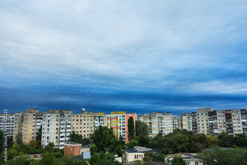 Storm clouds over block of flats