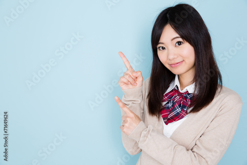 young asian woman on blue background