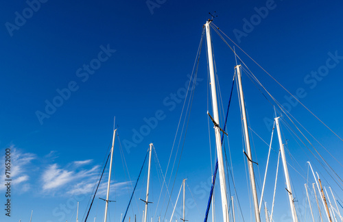 Looking up at the mainmasts of a yacht. photo