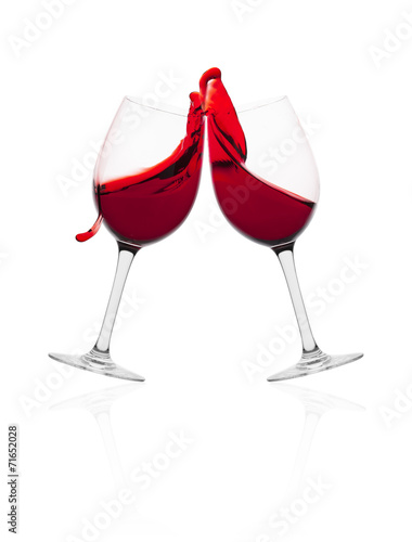 Wine glasses in with splash of wine