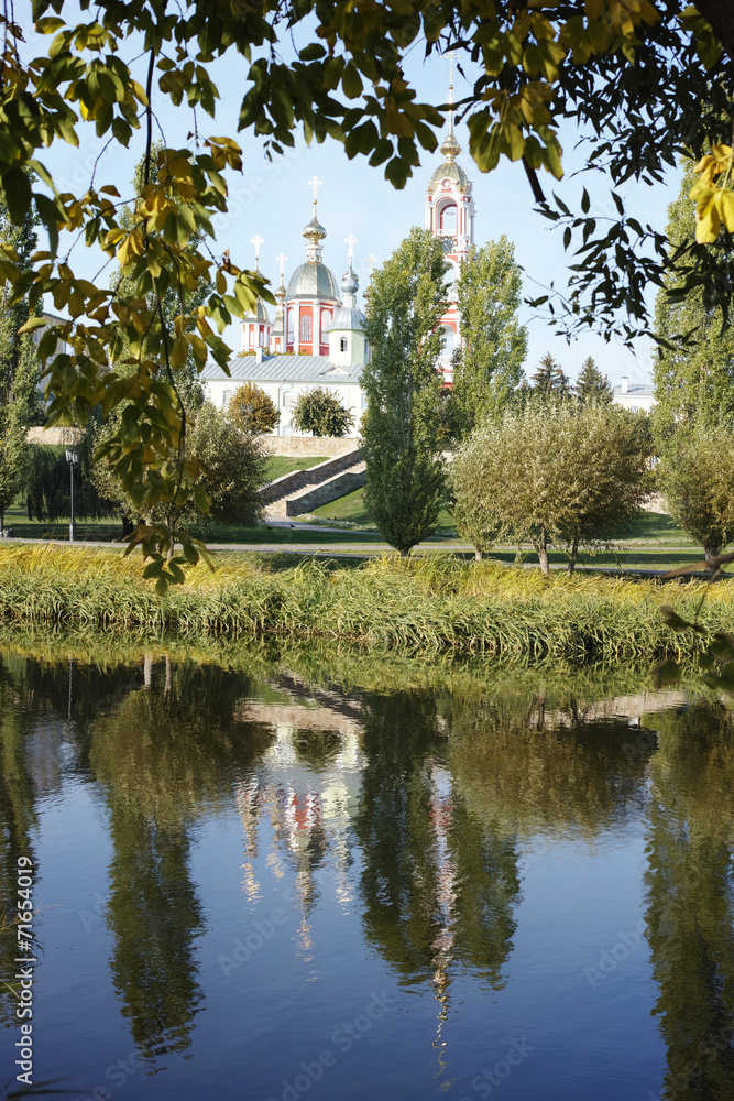 Church and bell tower on the riverbank Church and bell tower on the riverbank