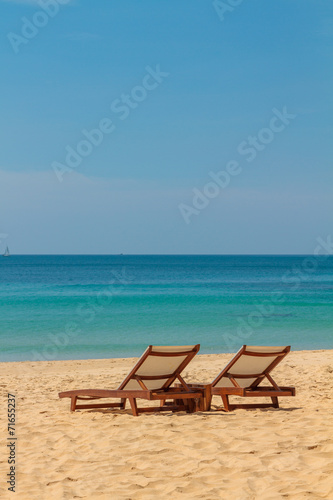 empty sunbeds on a gorgeous sandy beach