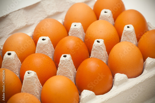 Chicken eggs of brown color in packaging