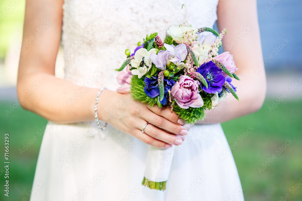 Beautiful bridal bouquet on a woman hands Beautiful bridal bouquet on a woman hands