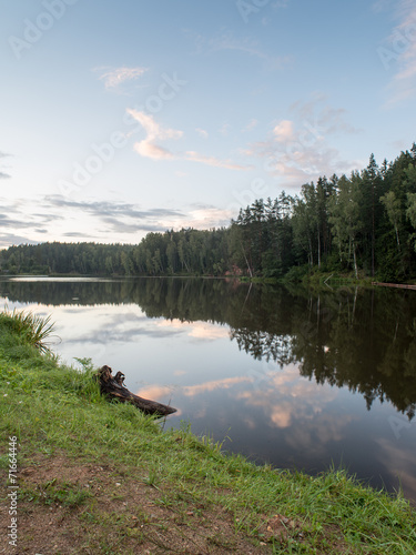 river with reflections in weater and sandstone cliffs