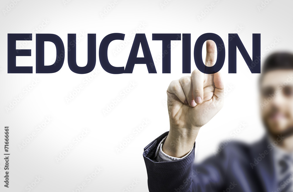 Business man pointing to transparent board with text: Education Business man pointing to transparent board with text: Education