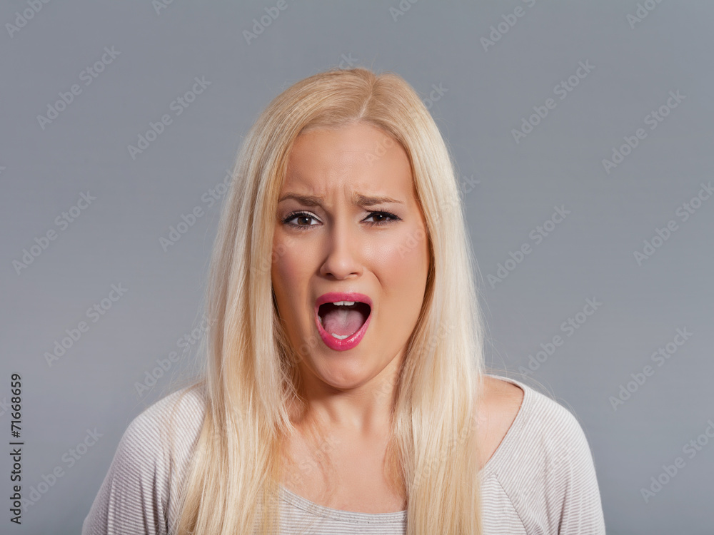 Frustrated young woman shouting. Frustrated young woman shouting.