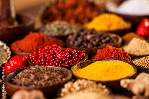 Spices in traditional Asian theme on wooden table