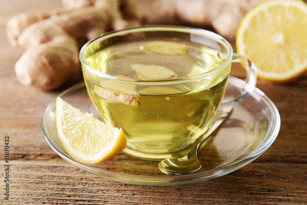 Ginger tea with lemon on table close-up Ginger tea with lemon on table close-up