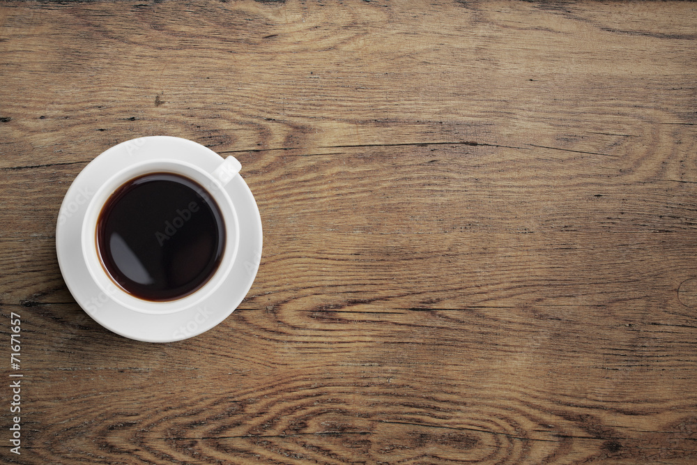 Black coffee cup on old wooden table top view - obrazy, fototapety, plakaty 