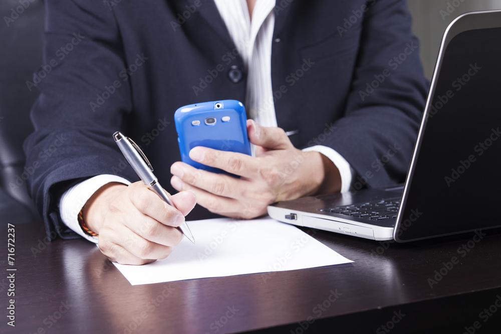 Business man's hands writing document Business man's hands writing document