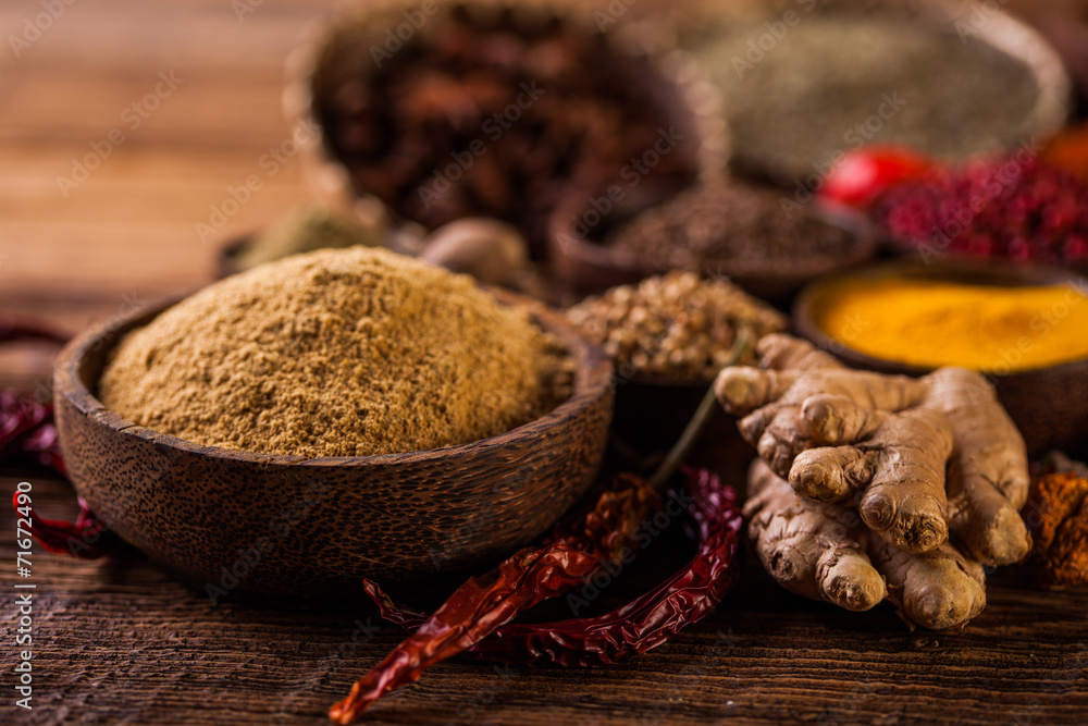 Wooden table of colorful spices