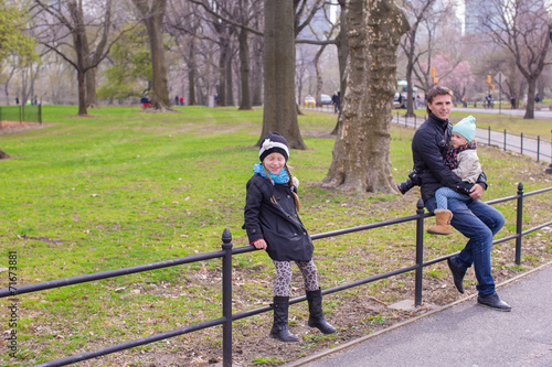 Young father and little daughters in Central Park