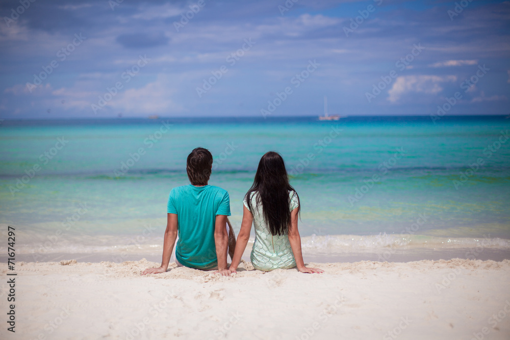 Young couple enjoying each other on sandy white beach Young couple enjoying each other on sandy white beach