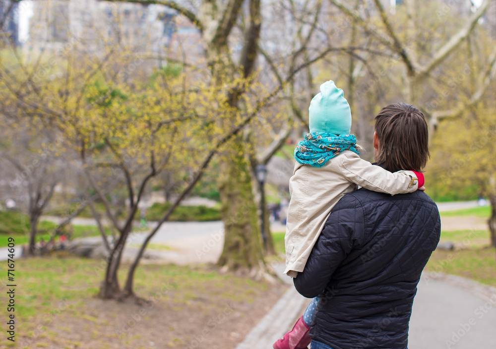 Young father and little daughter for a walk in Central Park Young father and little daughter for a walk in Central Park