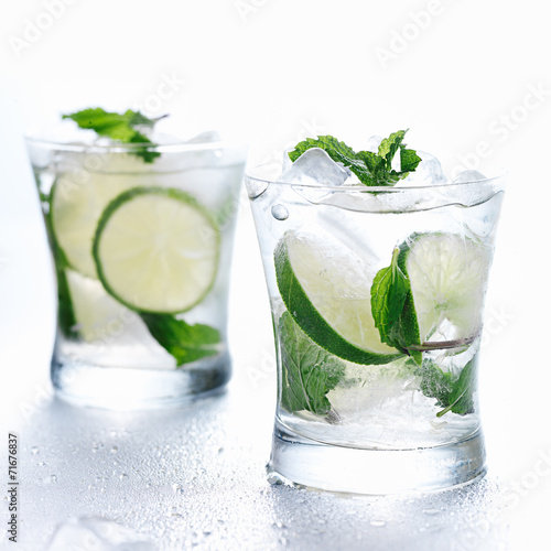 two mojito cocktails on background
