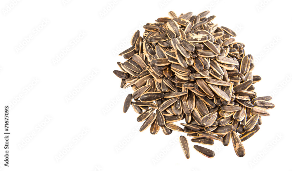Sunflower seeds over white background Sunflower seeds over white background