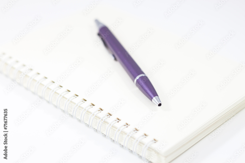 Spiral notebook and pen isolated on white background Spiral notebook and pen isolated on white background