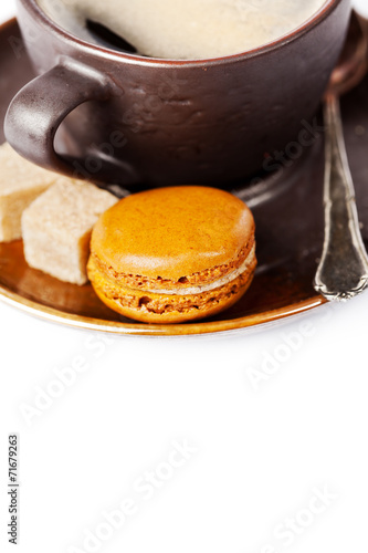 Cup of coffee and macaroons on white background, toned