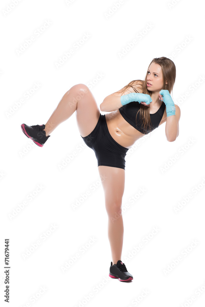 Young woman posing and kicking Young woman posing and kicking