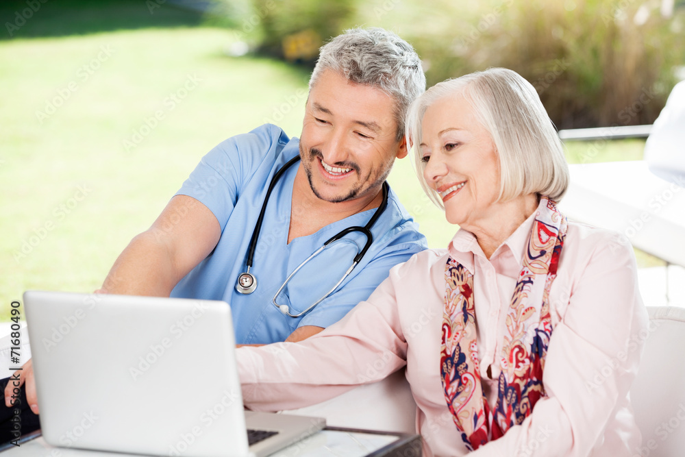 Caretaker And Senior Woman Using Laptop Caretaker And Senior Woman Using Laptop