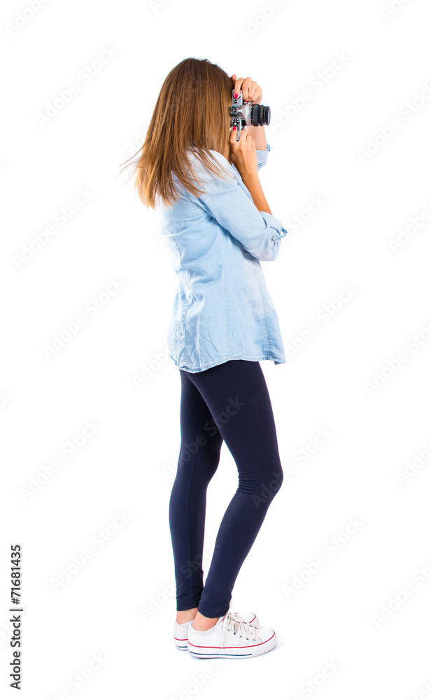 Girl photographing over white background Girl photographing over white background