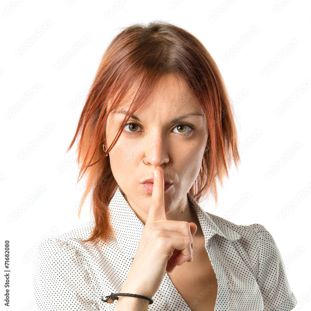 Girl making silence gesture over isolated white background Girl making silence gesture over isolated white background