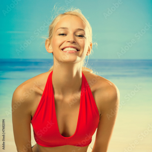 Young smiling beautiful woman on beach