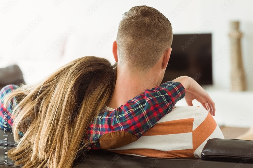 Obraz premium Cute couple relaxing on couch