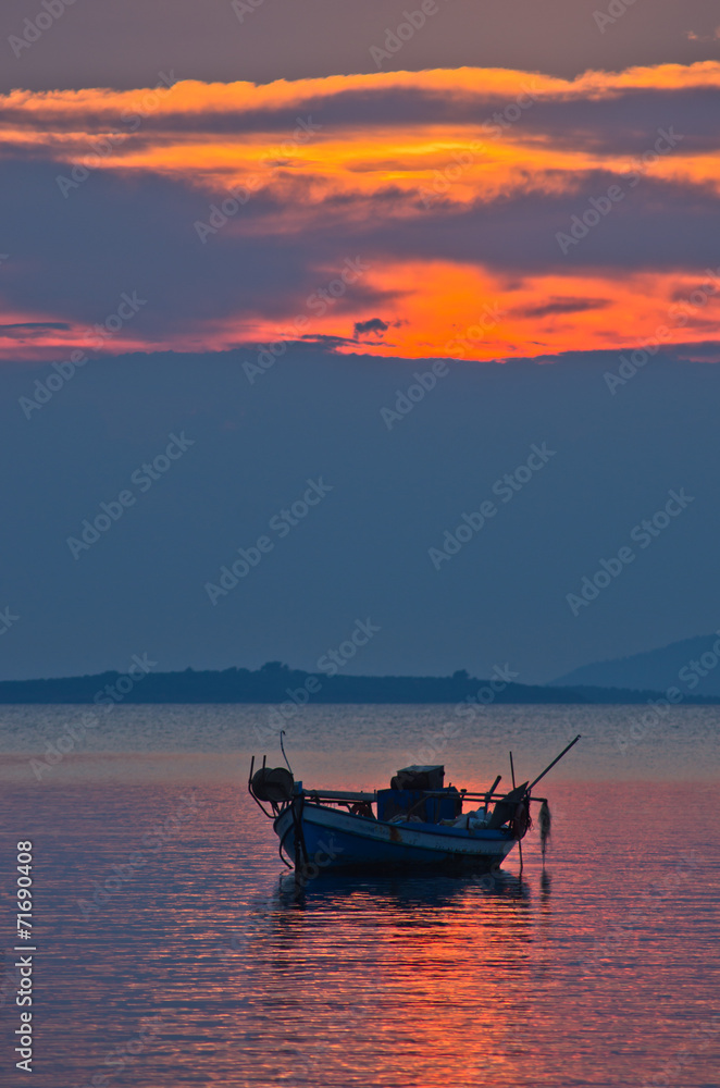 Silhouette of a fishing boat at sunset, Chalkidiki