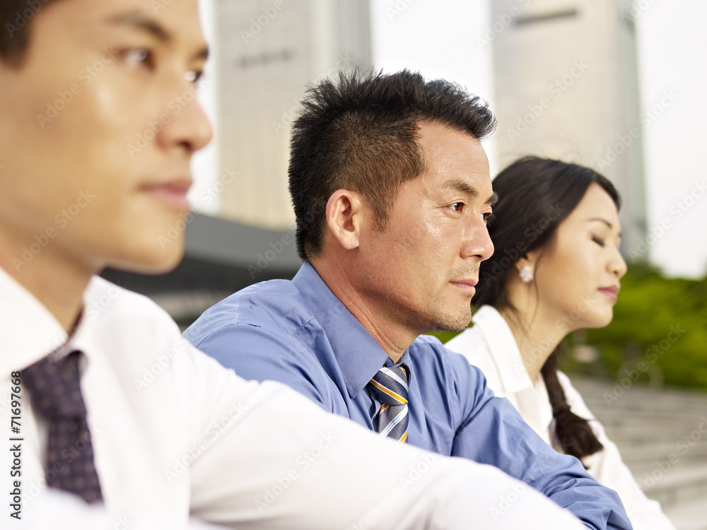 asian businesspeople feeling the pressure asian businesspeople feeling the pressure