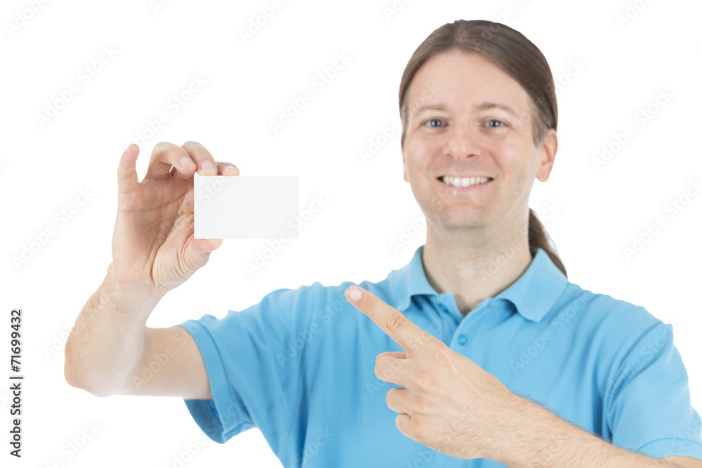 Smiling adult caucasian man pointing to a business sign card Smiling adult caucasian man pointing to a business sign card