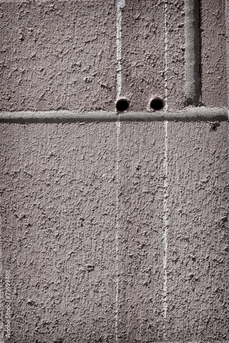 two holes in brick wall